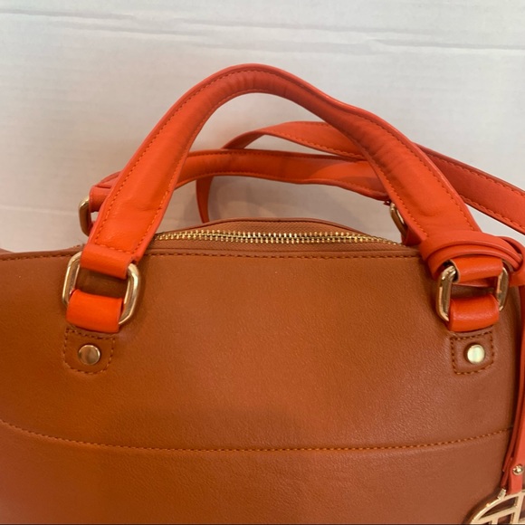 Orange handbag with a rust color body of bag and orange accent shoulder strap - Picture 4 of 16